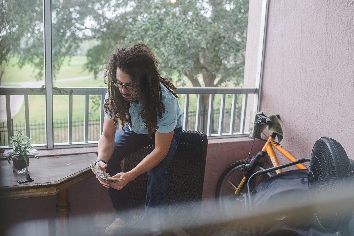 Derek Mateo handles cash in Orlando Florida, on December 29th, 2017.